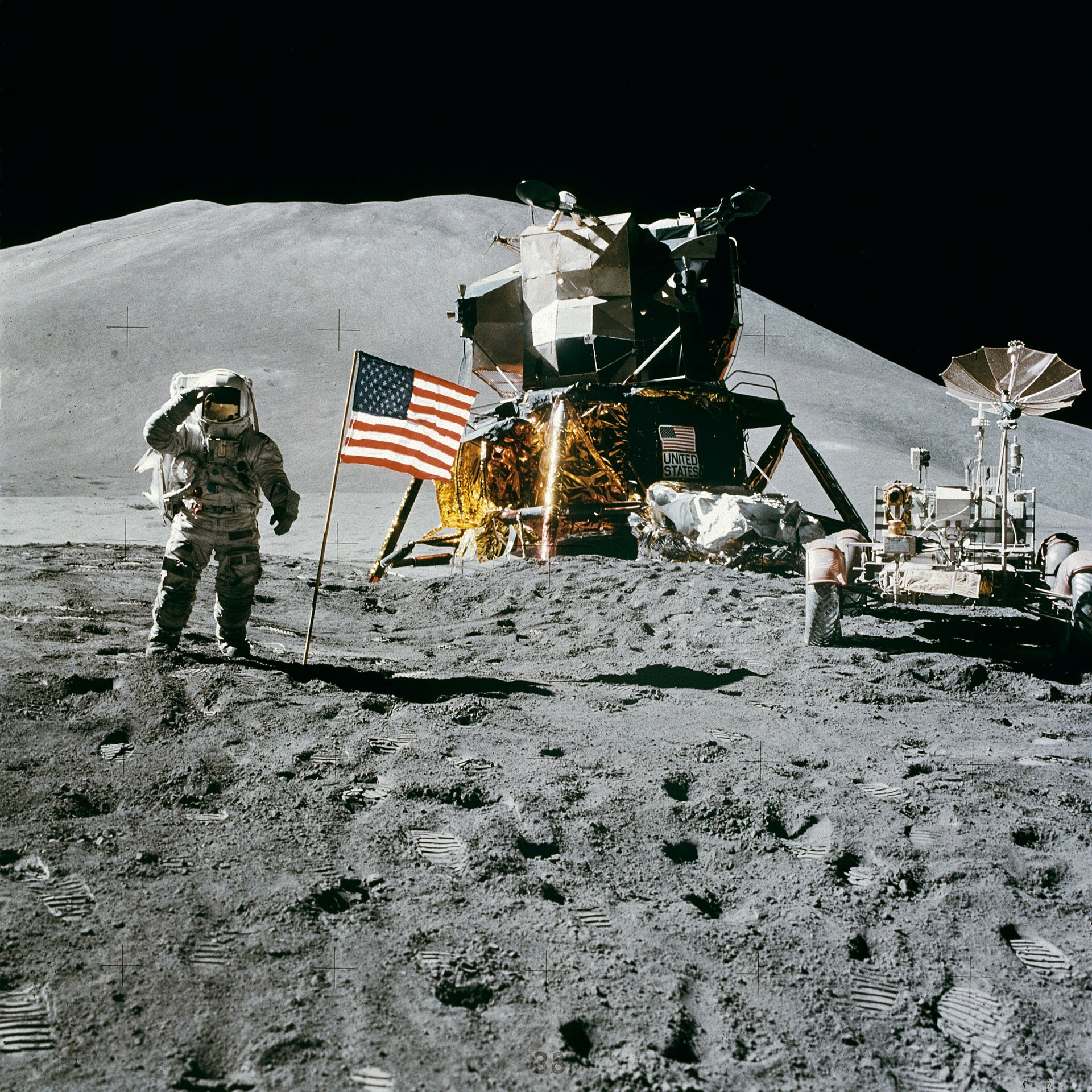 an astronaut on the surface of the moon with American flag and space ship