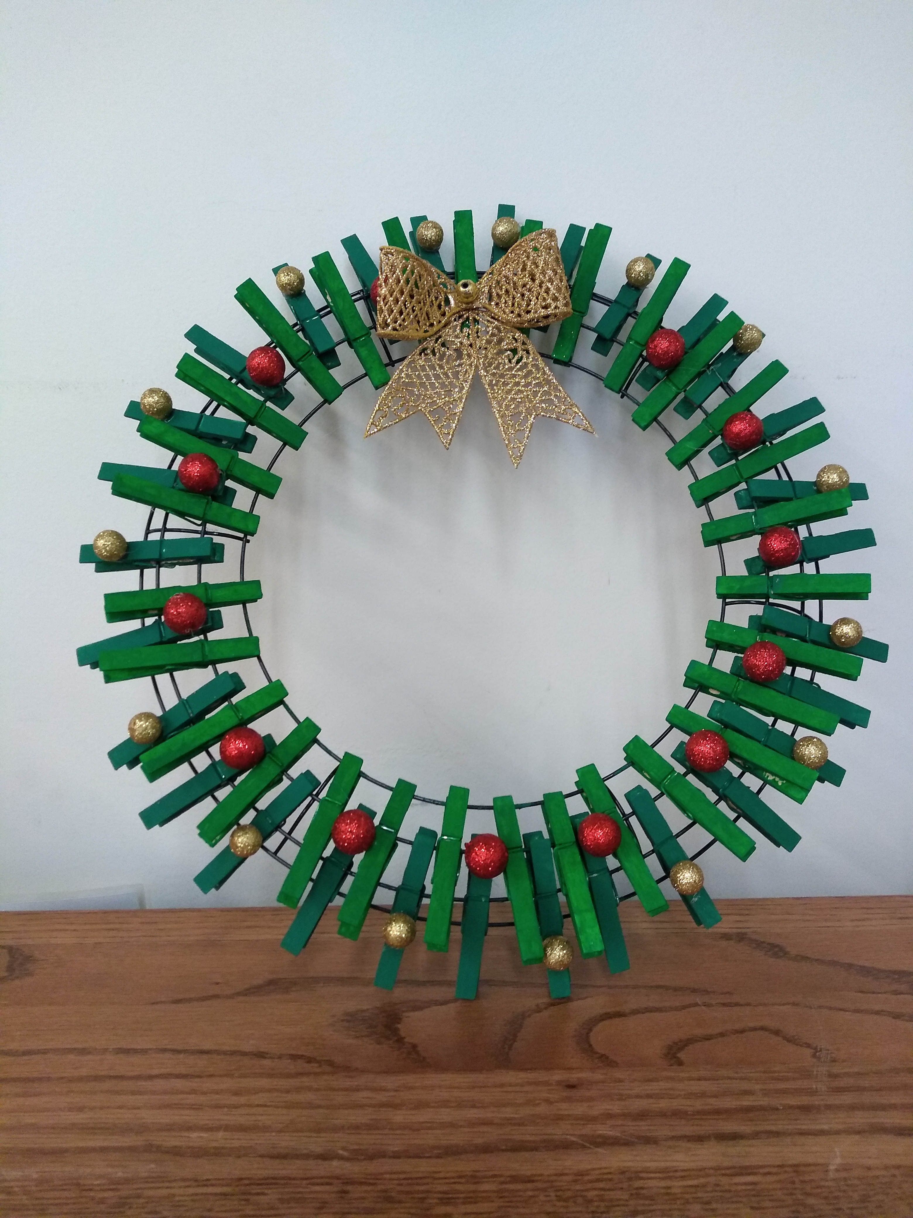 Green wreath made with clothespins