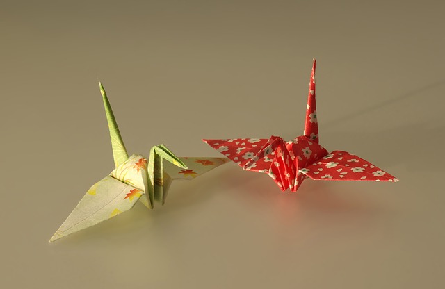 Two folded origami cranes