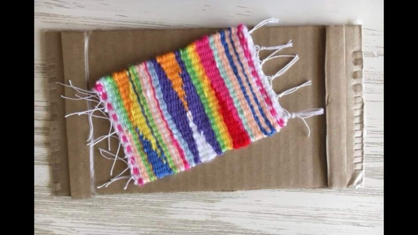 a colorful small woven dresser mat