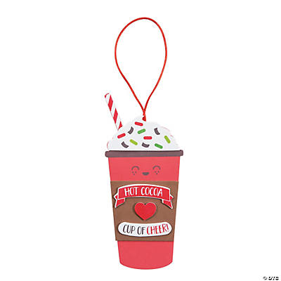 to go cup of hot cocoa with whipped cream and sprinkles