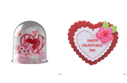 snow globe with hearts in it and a heart pin
