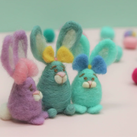 three bunnies made of wool roving needle felting