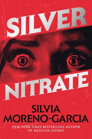 A woman's frightened eyes made out of concentric circles on a red background.