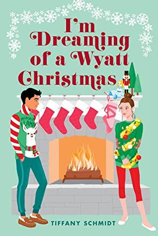 teen boy and girl in cheesy Christmas sweaters in front of fireplace