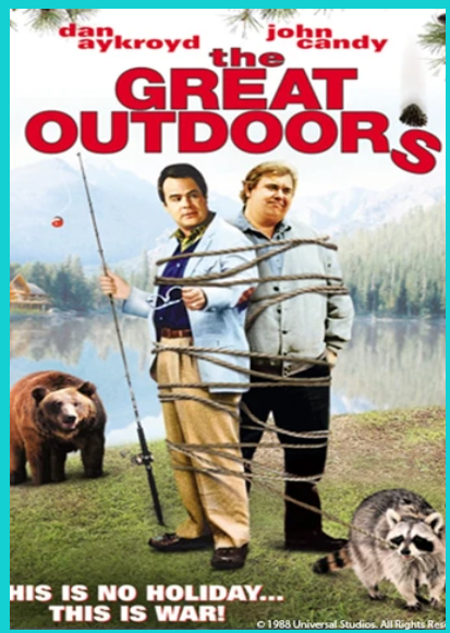 2 men outdoors surrounded by animals